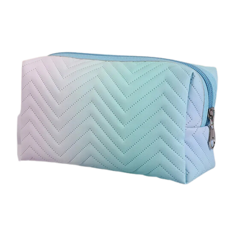 Let your beauty dreams come true with the Daydreamer Makeup Bag! Made with a soft ombre fabric, this bag will keep your cosmetics safe and secure - plus, its hip hue and unique design make it the perfect accessory to upgrade your makeup storage. Look your best wherever you go and dream away with this stylish bag!