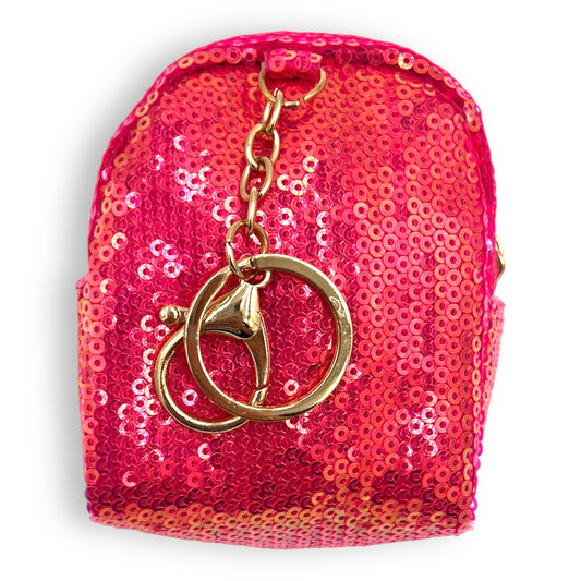 Brighten up your look with the stylish Glimmer Sequin Coin Purse! This glitzy must-have is the perfect way to keep your coins in one place. 