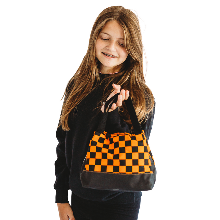 Our Checkered Halloween Bag is the perfect way to spook up your wardrobe this fall! With a classic vintage design in vibrant orange & black, it's sure to bring a little bit of frightful fun to any traditional get-up. Boo-yah!