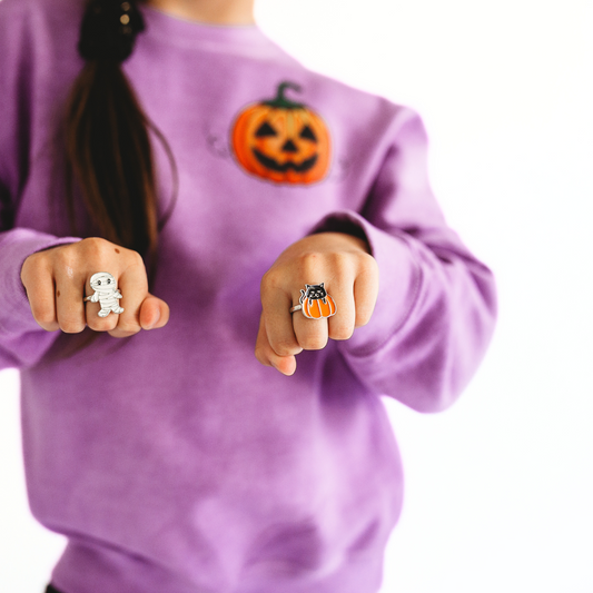 These Halloween rings are the perfect accessory for the season, featuring Mummy and Pumpkin Cat designs, let these playful pieces of jewelry add a dash of spooky to your style.