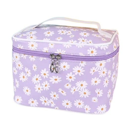 Go wild for this Delia Makeup Bag featuring a daisy pattern that’ll add a bit of flower power to any beauty look. Perfect for organizing your essentials, this stylish bag is sure to become your beauty BFF.