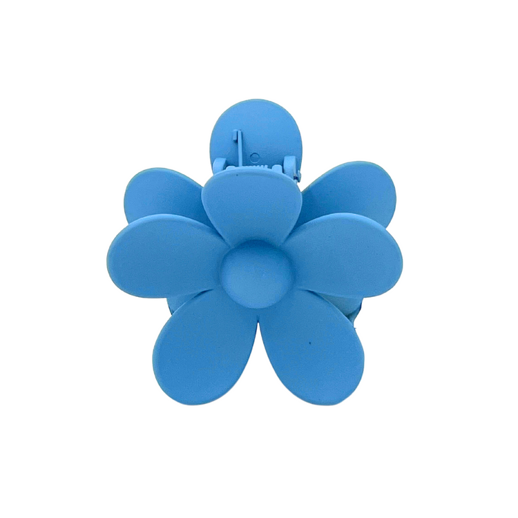 Make a statement with our Malibu Girl Hair Claw! This fun and flirty flower-shaped hair accessory is perfect for any occasion. Get ready to turn heads and have all eyes on you!