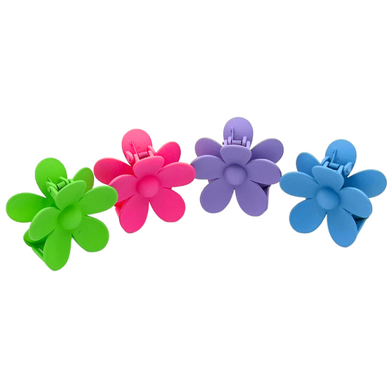 Make a statement with our Malibu Girl Hair Claw! This fun and flirty flower-shaped hair accessory is perfect for any occasion. Get ready to turn heads and have all eyes on you!