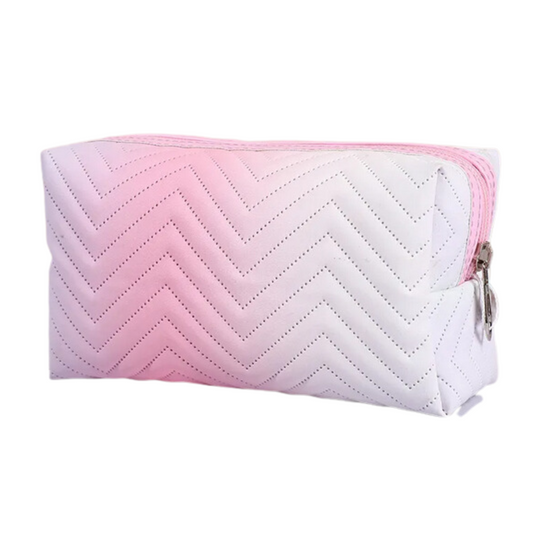 Let your beauty dreams come true with the 'Daydreamer Makeup Bag'! Made with a soft ombre fabric, this bag will keep your cosmetics safe and secure - plus, its hip hue and unique design make it the perfect accessory to upgrade your makeup storage. Look your best wherever you go and dream away with this stylish bag!